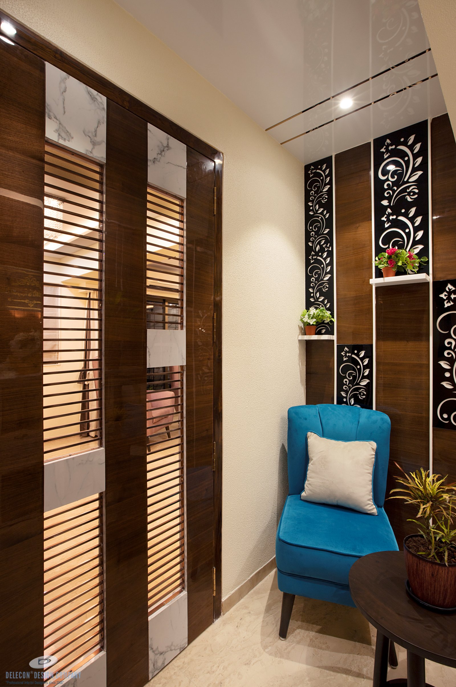 Entrance lobby with storage and panelling in Panvel residence