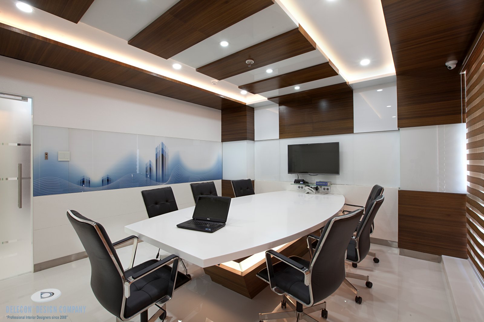 Board room interior design with veneer panelling and soft lighting at Belapur