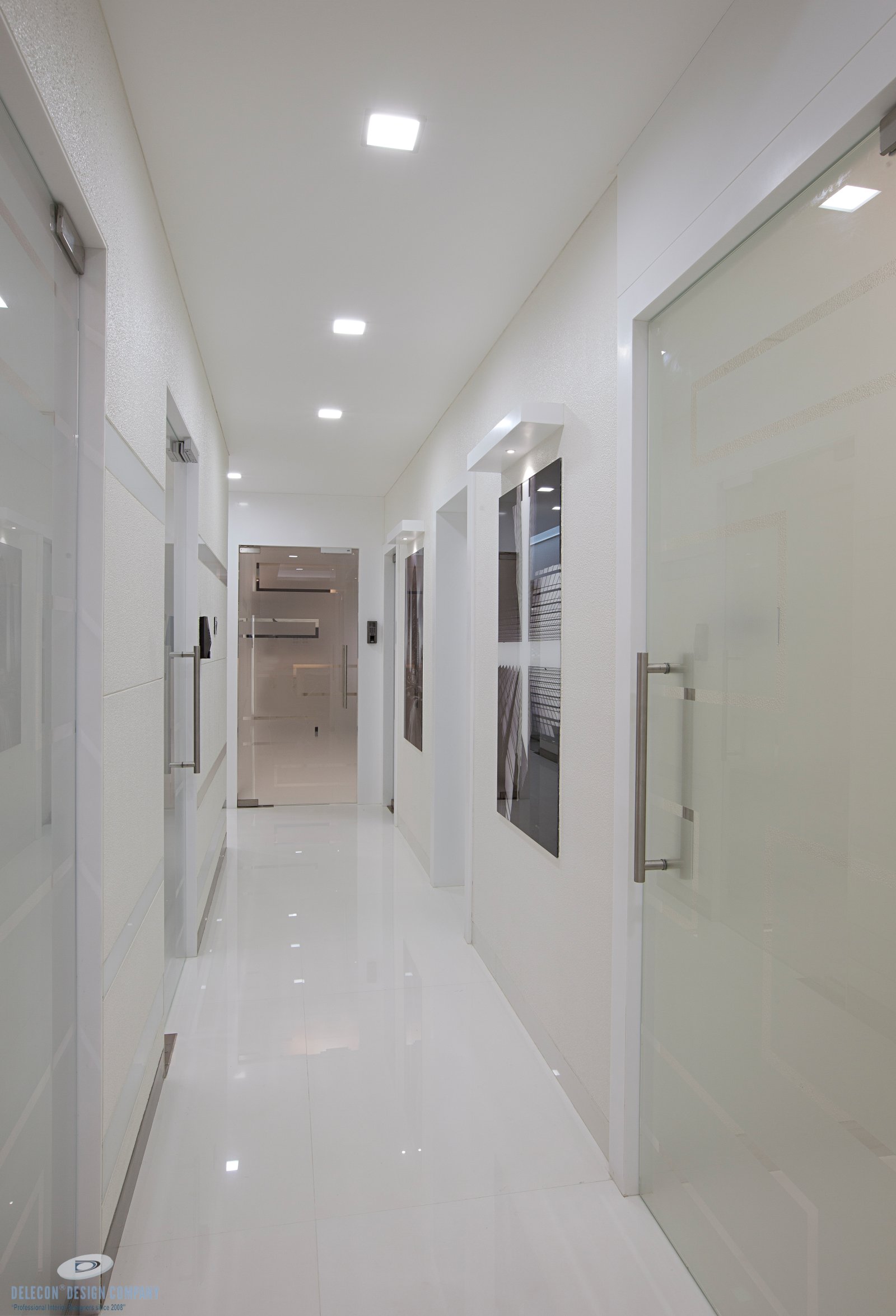 Office passage design with artwork and lighting in Belapur